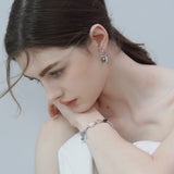 Gray Bow Pearl Earrings