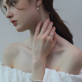 CH Mini Bow Pearl Earrings